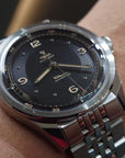 Close up YEMA FLYGRAF Pilot automatic wristwatch with stainless steel bracelet and black dial display