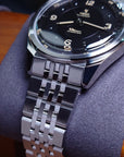 YEMA FLYGRAF Pilot automatic wristwatch with stainless steel bracelet close up.