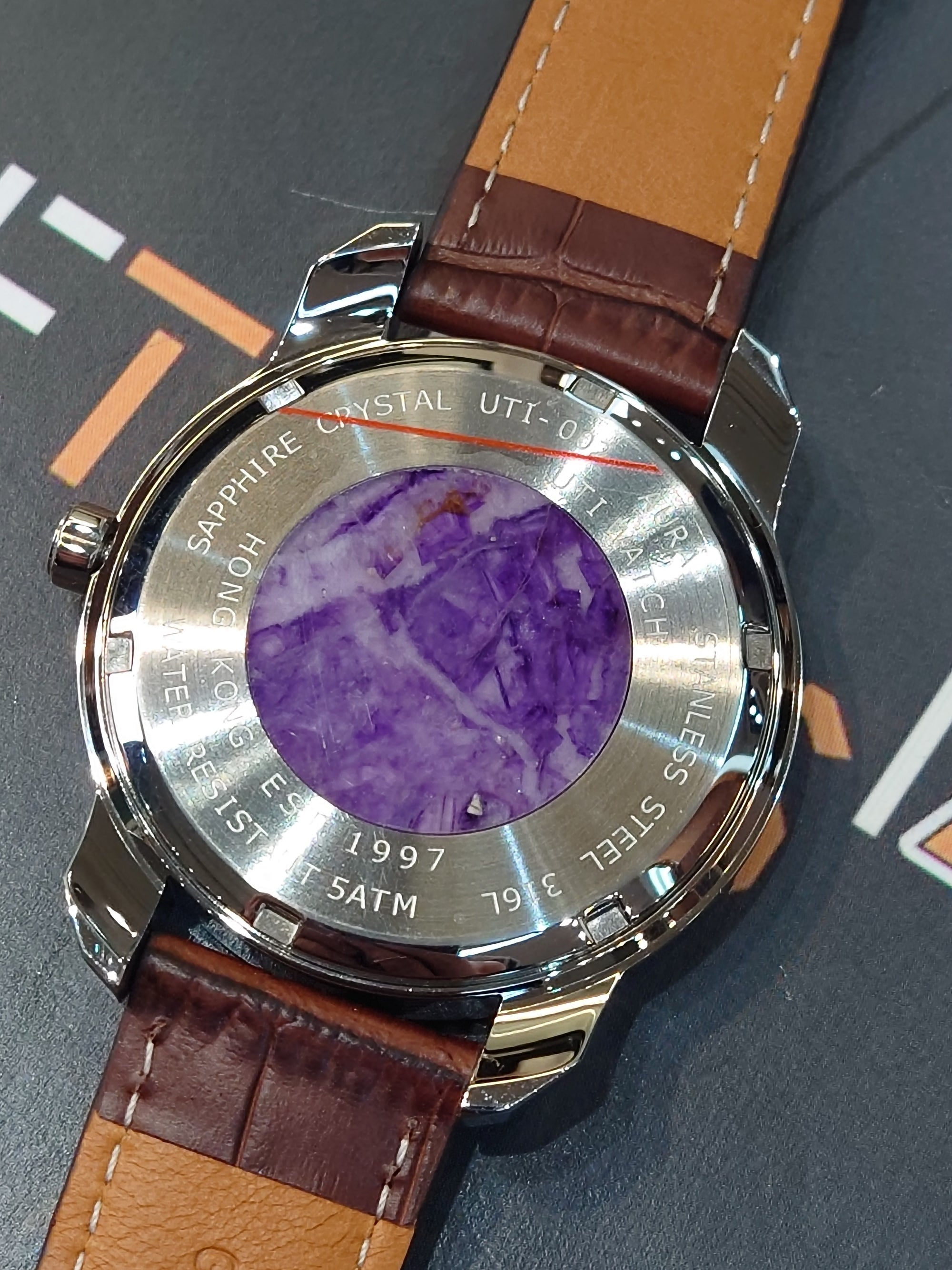 UTI 紫石面石英錶